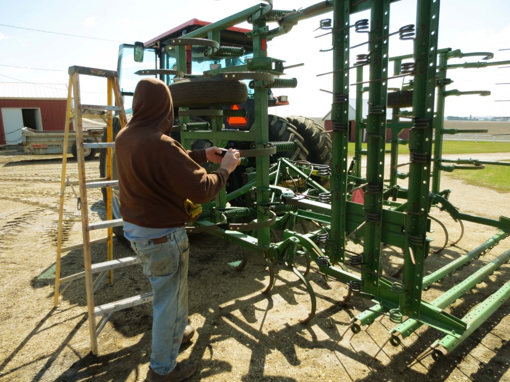 Daryl working on the field cultivator 