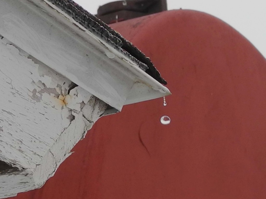 Snow melting off of a shed on our farm