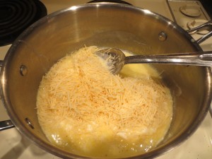 Mixing in the cheese for the Alfredo sauce